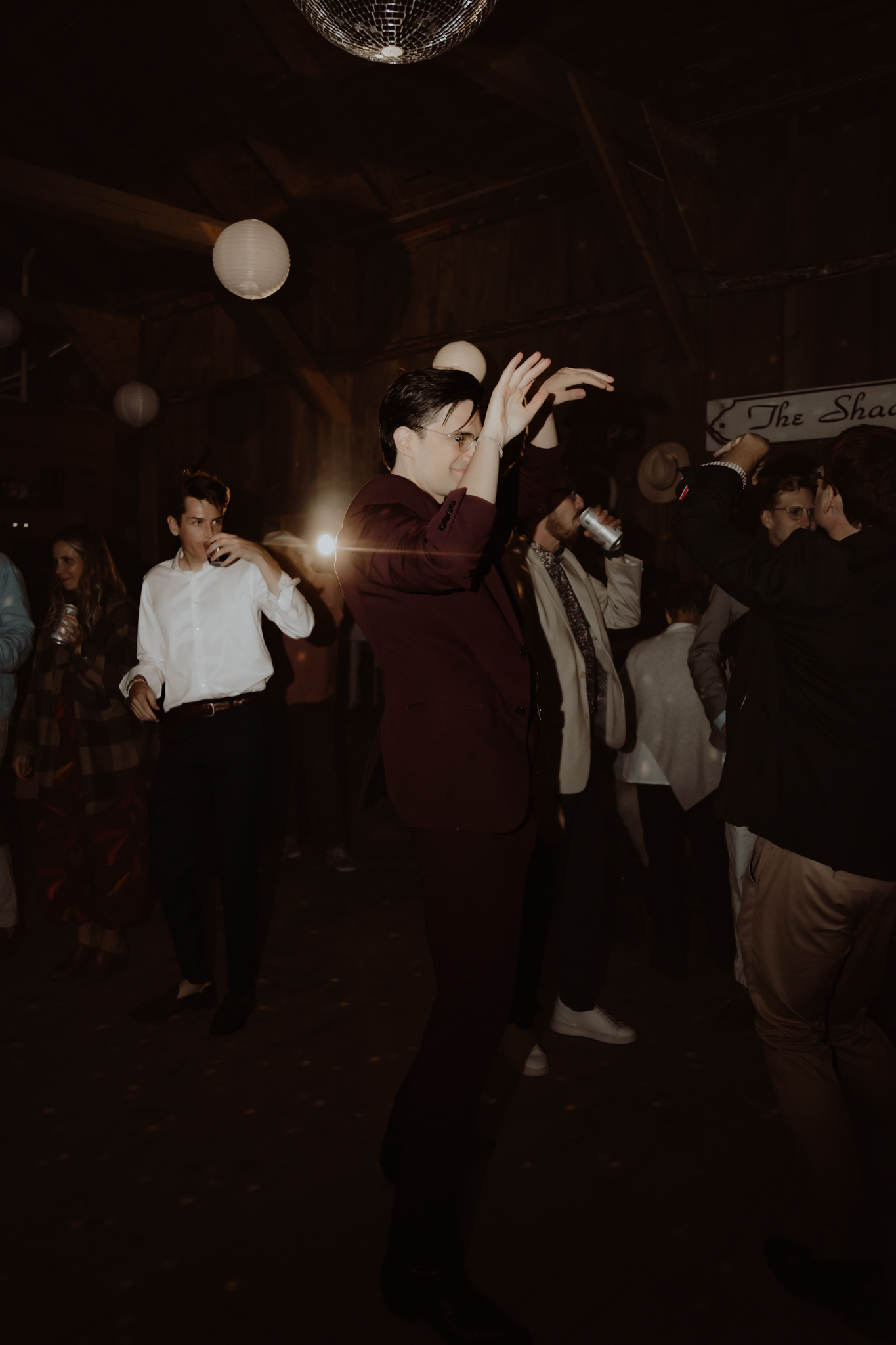A man dances at a retro wedding in Maine
